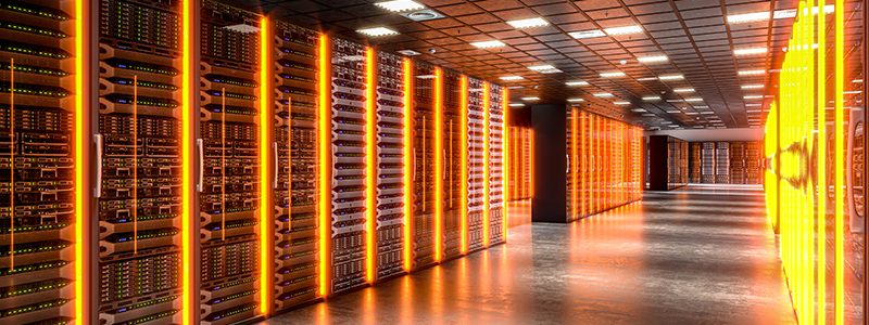 Symbolizing the power of technology and data storage: server racks in a modern data center glowing with orange lights
